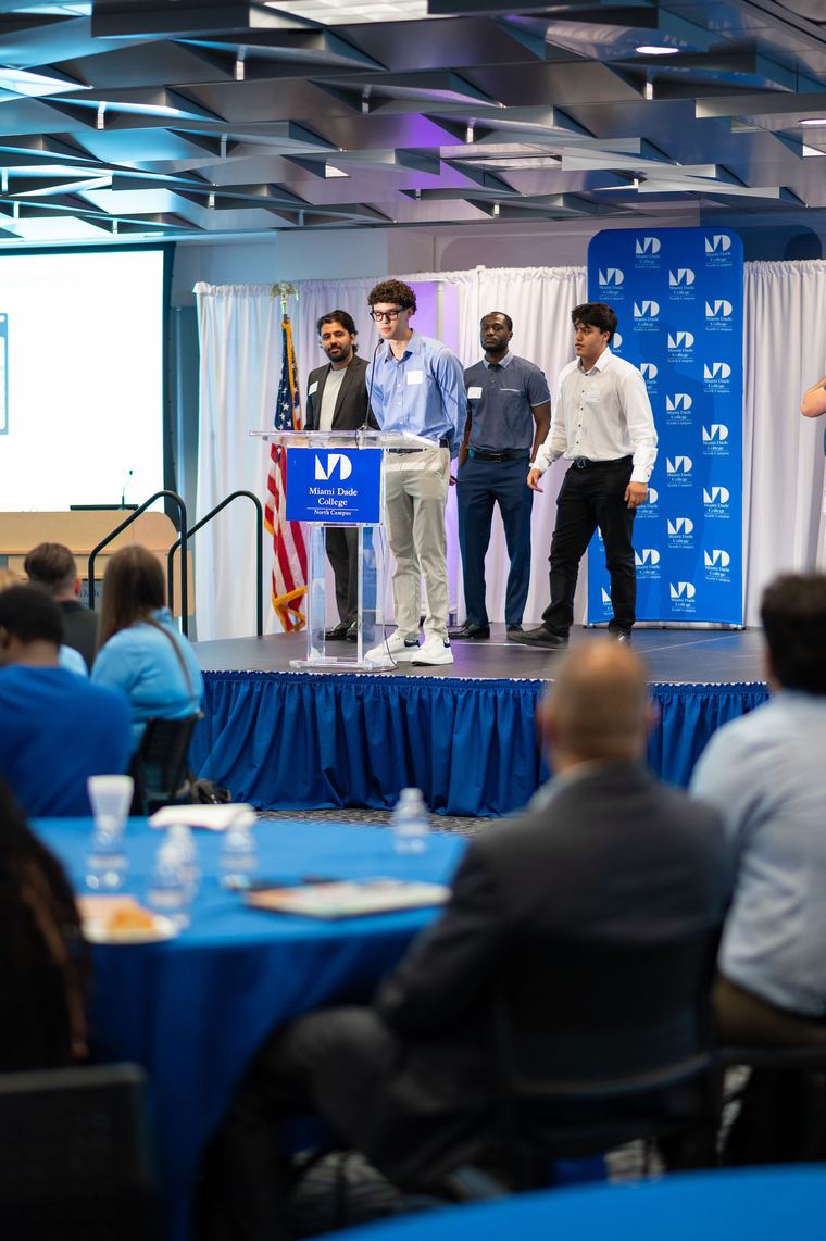 Aloyd team presenting on stage